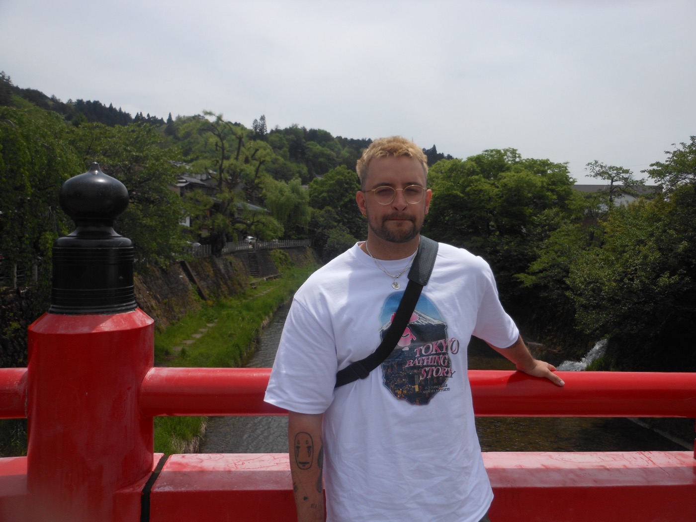 Benny on a red bridge in Takayama, Japan
